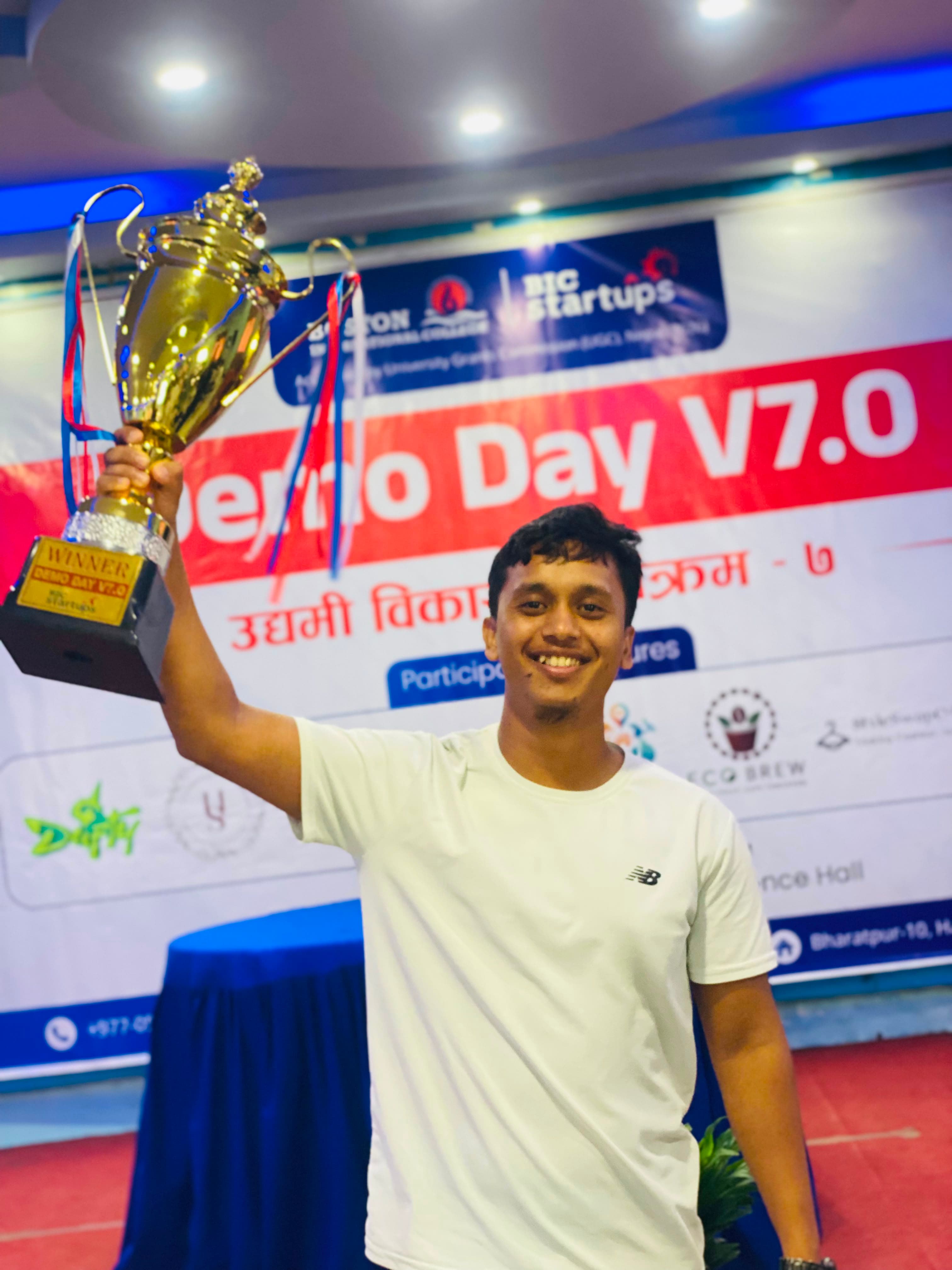 Bibek Sunar holding the Demo Day 7.0 winner trophy for Himurja Skincare